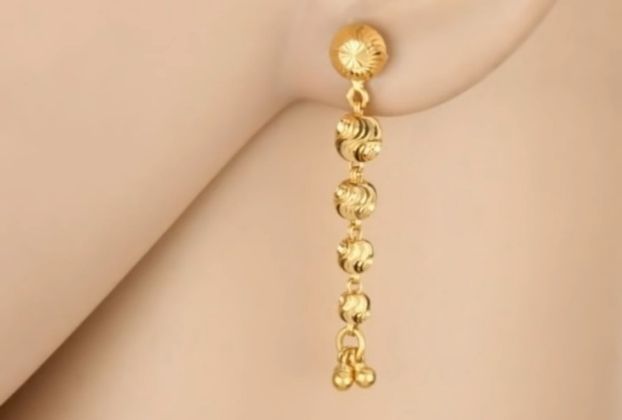 fancy gold earrings sui dhaga design with women