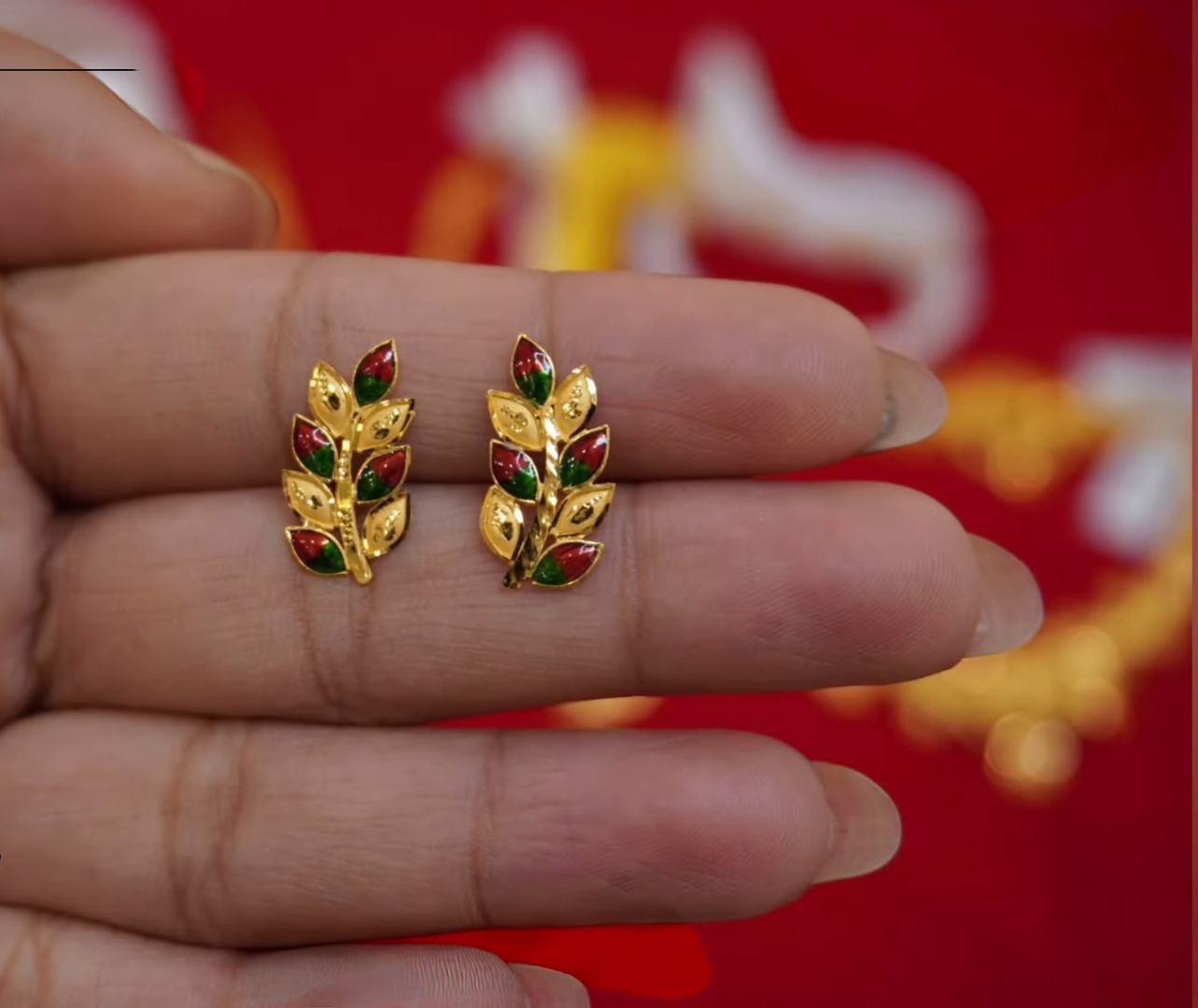 The earring design looks like a vine leaf.